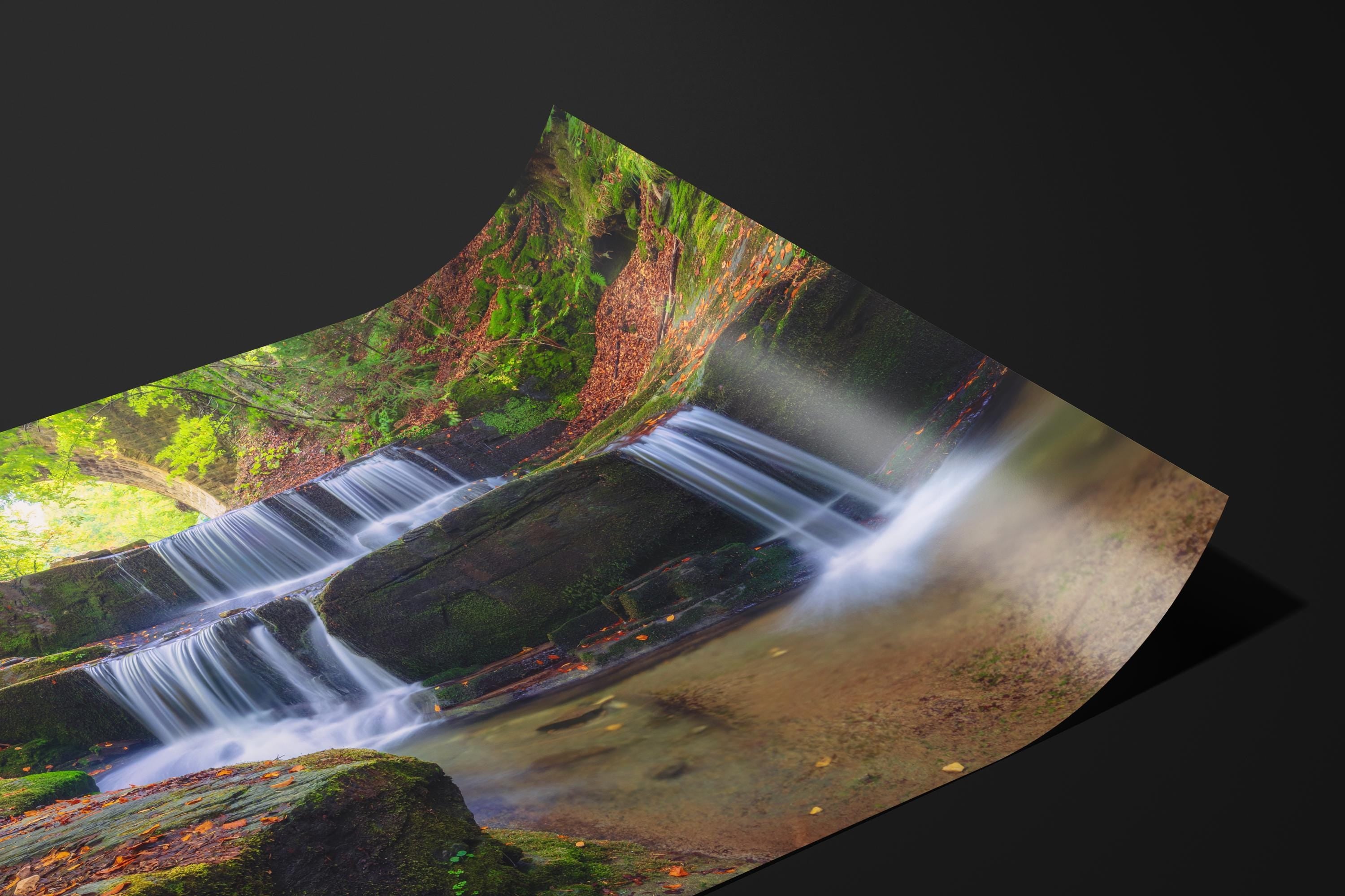 Tranquil Waterfall Under Stone Bridge